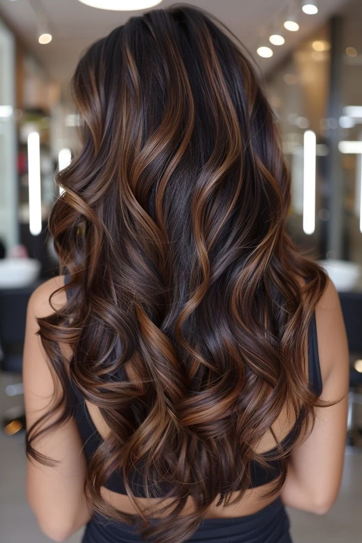Dark brunette hair with hand-painted caramel balayage