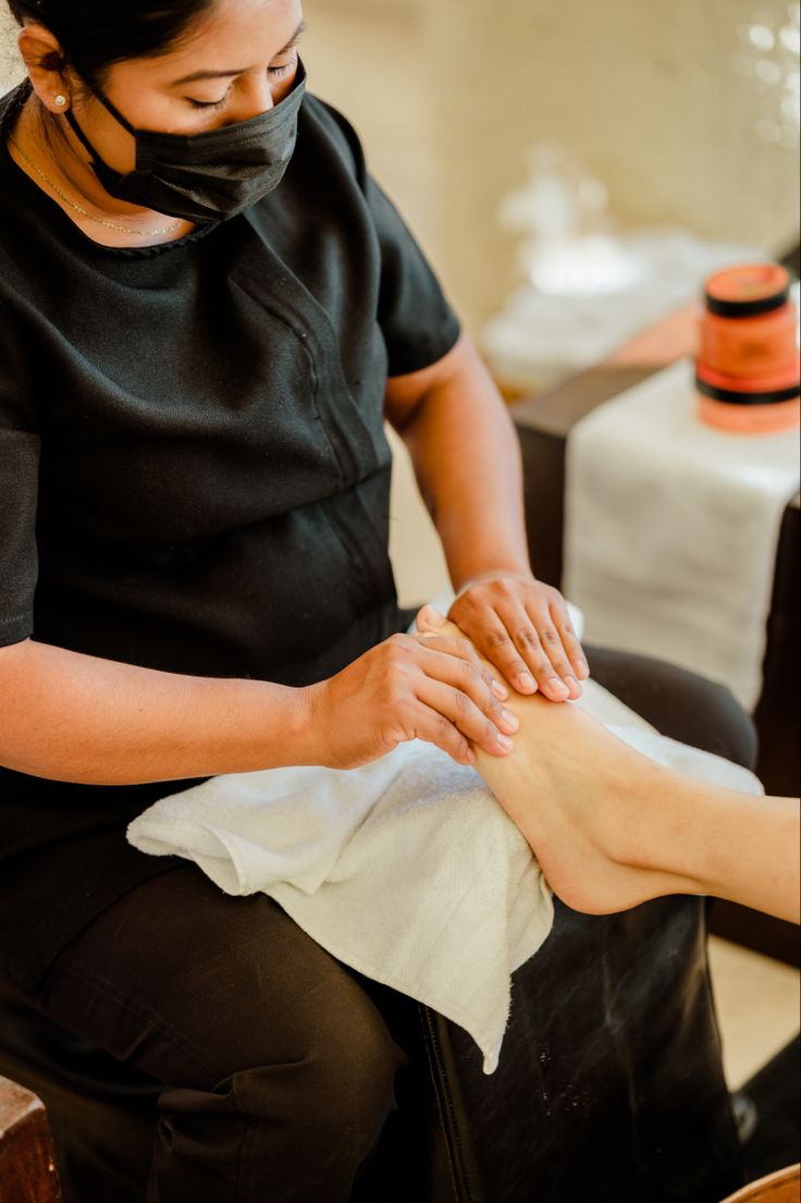 Specialist performing a spa pedicure ritual